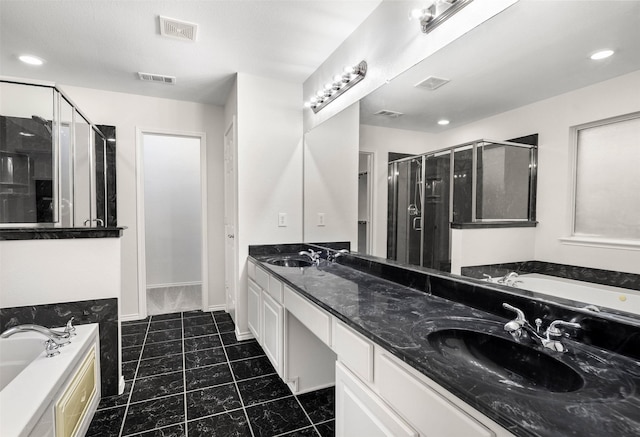 908 Trinity Dr, Lancaster, TX 75146 - bathroom featuring a garden tub, a stall shower, double vanity, tile patterned floors, and recessed lighting