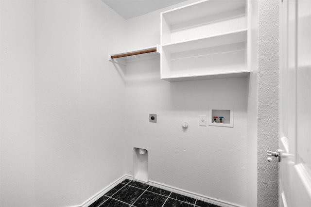 908 Trinity Dr, Lancaster, TX 75146 - washroom with electric dryer hookup, dark tile patterned flooring, washer hookup, and gas dryer hookup