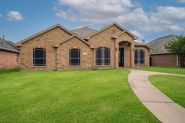 908 Trinity Dr, Lancaster, TX 75146 - view of front facade featuring brick siding and a front lawn