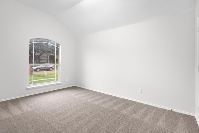 908 Trinity Dr, Lancaster, TX 75146 - empty room with carpet flooring and vaulted ceiling