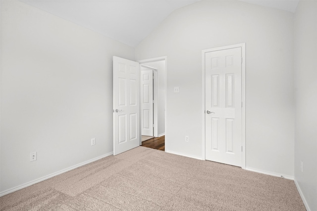 908 Trinity Dr, Lancaster, TX 75146 - unfurnished bedroom featuring carpet and lofted ceiling
