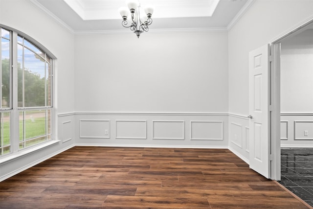 908 Trinity Dr, Lancaster, TX 75146 - unfurnished dining area featuring dark wood-style floors, a chandelier, crown molding, and wainscoting