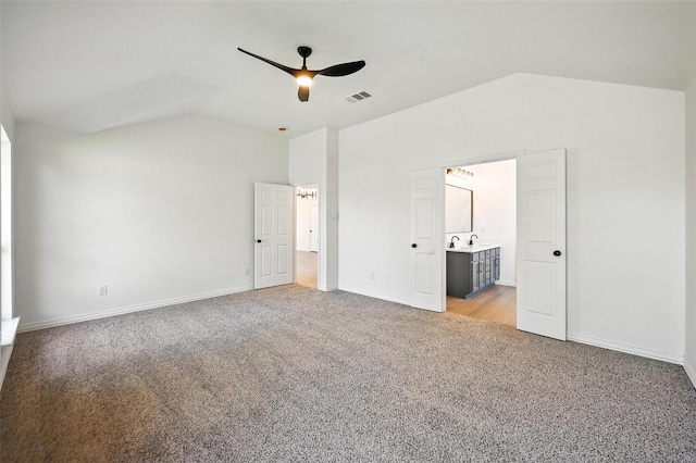 713 Madeline Ct, Azle, TX 76020 - unfurnished bedroom with lofted ceiling, light colored carpet, connected bathroom, and a ceiling fan