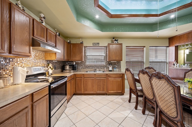 3060 Saint Nicholas Dr, Dallas, TX 75233 - kitchen featuring stainless steel electric stove, under cabinet range hood, a tray ceiling, and light countertops
