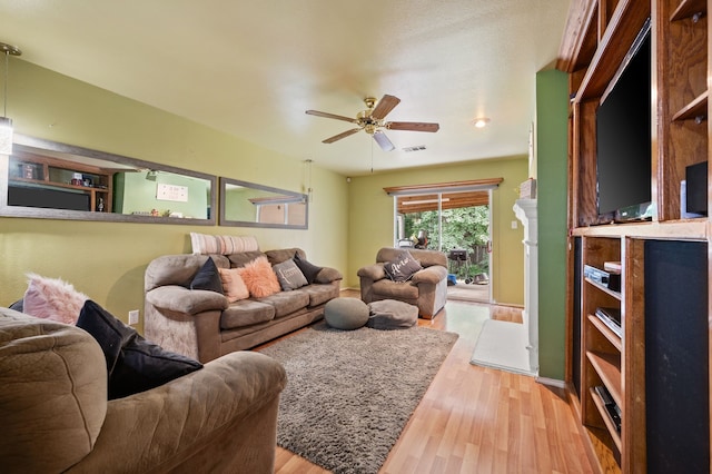 3060 Saint Nicholas Dr, Dallas, TX 75233 - living area with light wood-style flooring and a ceiling fan