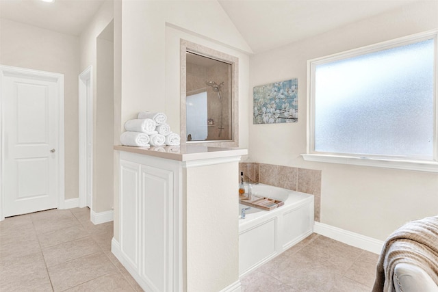 9809 Trinity Dr, Little Elm, TX 75068 - full bathroom featuring a garden tub, tile patterned flooring, a tile shower, and lofted ceiling