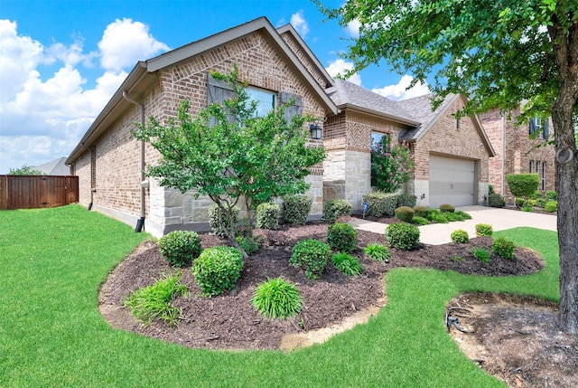 9809 Trinity Dr, Little Elm, TX 75068 - view of front of house with brick siding, driveway, and a garage
