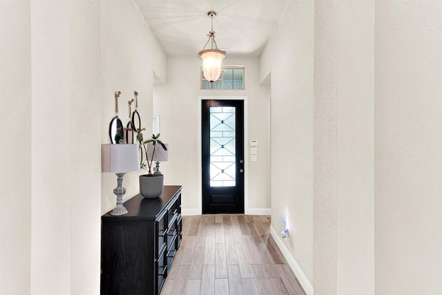 9809 Trinity Dr, Little Elm, TX 75068 - foyer entrance featuring light wood-type flooring and healthy amount of natural light