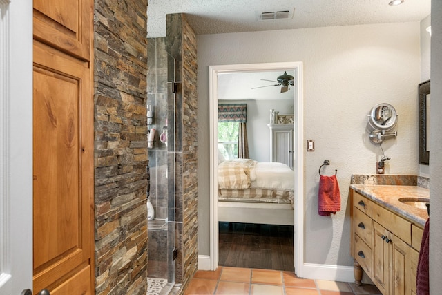 3901 Woodside Dr, Arlington, TX 76016 - ensuite bathroom featuring vanity, a shower stall, a ceiling fan, and tile patterned floors