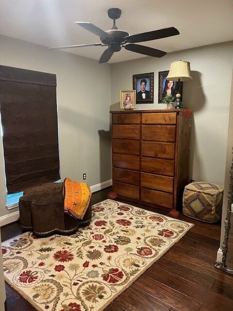 3901 Woodside Dr, Arlington, TX 76016 - living area with wood finished floors and ceiling fan