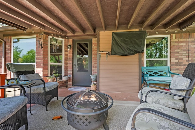 3901 Woodside Dr, Arlington, TX 76016 - view of patio / terrace with an outdoor fire pit