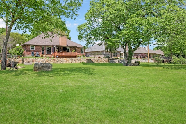 3901 Woodside Dr, Arlington, TX 76016 - view of grassy yard featuring a wooden deck