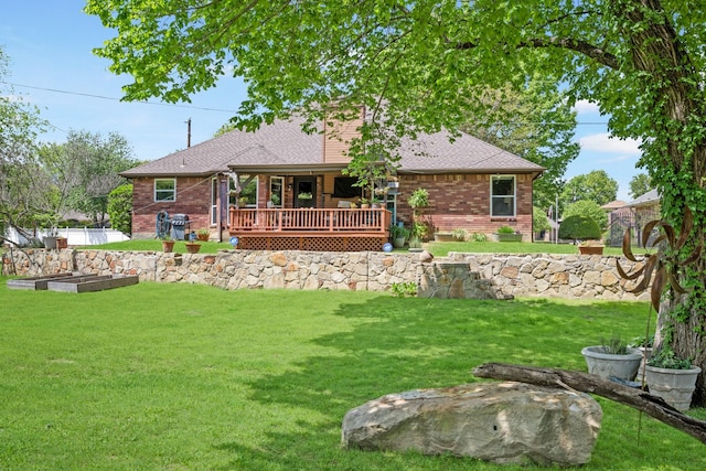 3901 Woodside Dr, Arlington, TX 76016 - back of property with brick siding, a lawn, a garden, and roof with shingles