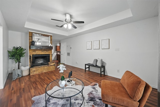 515 Signal Hill Ct S, Fort Worth, TX 76112 - living room featuring a raised ceiling, a brick fireplace, and wood finished floors