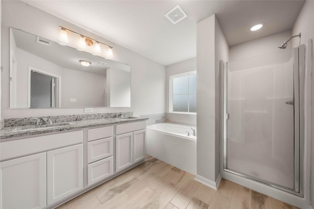 4020 Centerfire Rd, Waco, TX 76705 - bathroom with a shower stall, a bath, and double vanity