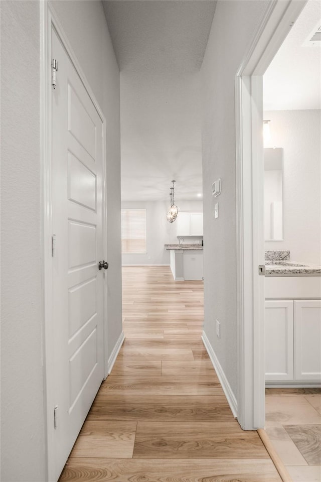 4020 Centerfire Rd, Waco, TX 76705 - hall featuring light wood-type flooring and baseboards