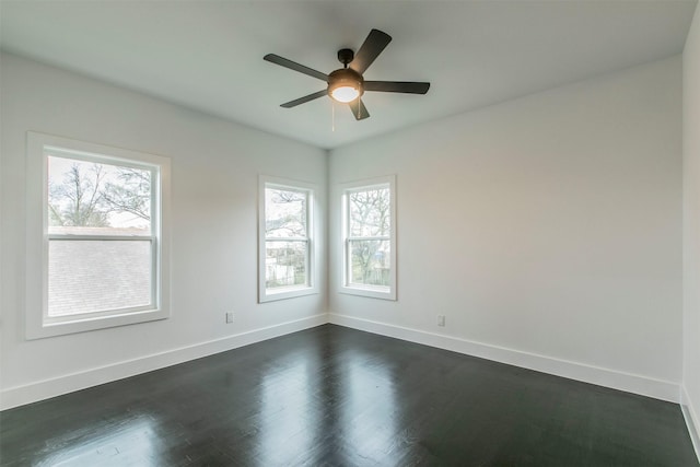 407 Dubois Ave, Dallas, TX 75203 - spare room featuring dark wood-type flooring and a ceiling fan