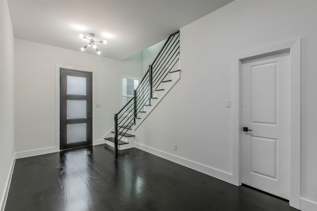 407 Dubois Ave, Dallas, TX 75203 - foyer featuring stairs, dark wood-type flooring, and a chandelier