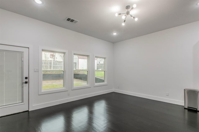407 Dubois Ave, Dallas, TX 75203 - spare room with healthy amount of natural light, dark wood-style floors, recessed lighting, and a chandelier