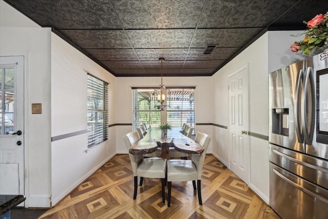 1701 Prairie Creek Ct, Garland, TX 75040 - dining space with a chandelier and an ornate ceiling