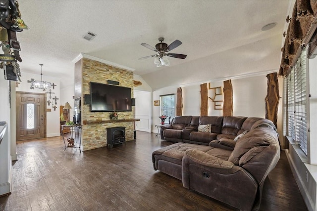 1701 Prairie Creek Ct, Garland, TX 75040 - living area featuring ceiling fan, dark wood-style floors, a textured ceiling, vaulted ceiling, and a chandelier