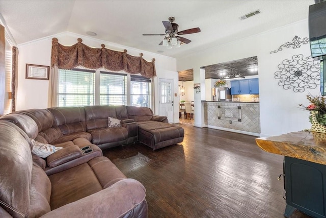 1701 Prairie Creek Ct, Garland, TX 75040 - living area featuring ceiling fan, dark wood-type flooring, crown molding, and lofted ceiling