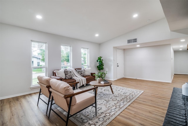 601 Red Ash Cir, Mesquite, TX 75150 - living room featuring plenty of natural light, light wood-style flooring, lofted ceiling, and recessed lighting