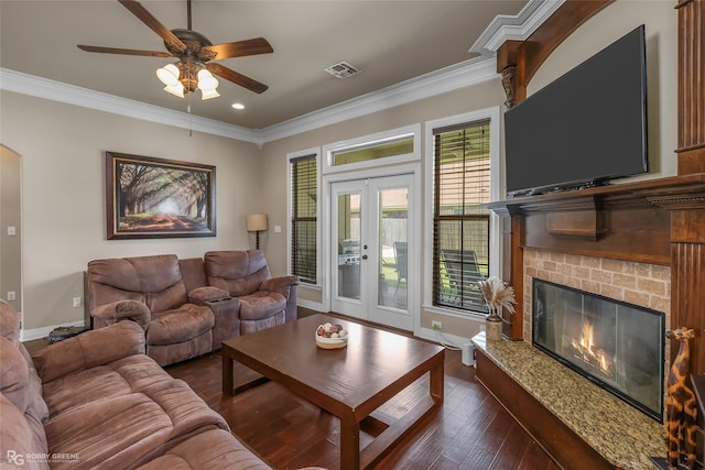 615 Canoe Trl, Bossier City, LA 71111 - living area with a glass covered fireplace, ornamental molding, a ceiling fan, dark wood finished floors, and recessed lighting