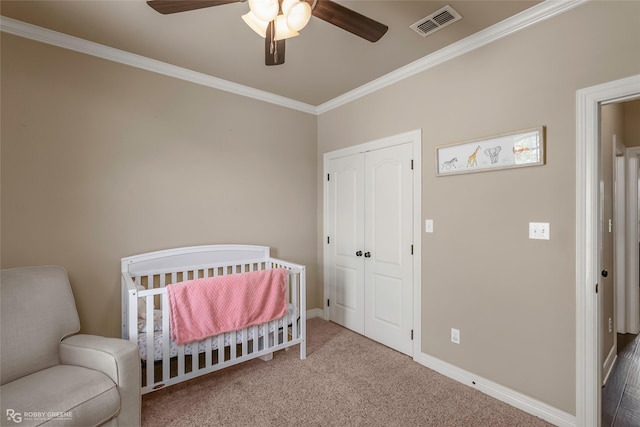 615 Canoe Trl, Bossier City, LA 71111 - carpeted bedroom with crown molding, a closet, a crib, and a ceiling fan