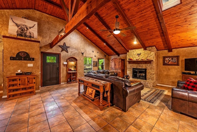 188 Hacienda, Pottsboro, TX 75076 - tiled living area featuring a wood ceiling with exposed beams, a ceiling fan, a stone fireplace, high vaulted ceiling, and arched walkways