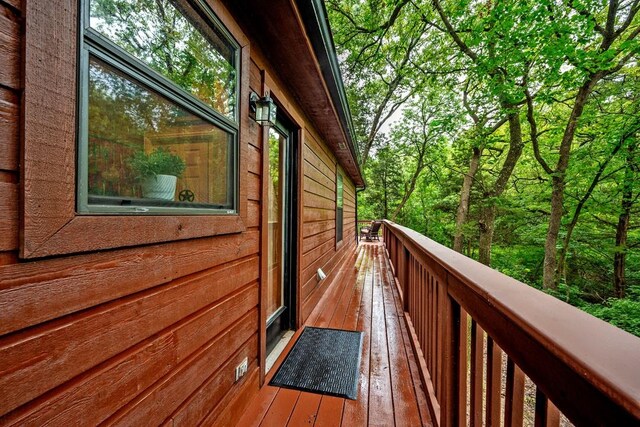 188 Hacienda, Pottsboro, TX 75076 - view of side of property with a wooded view and a balcony