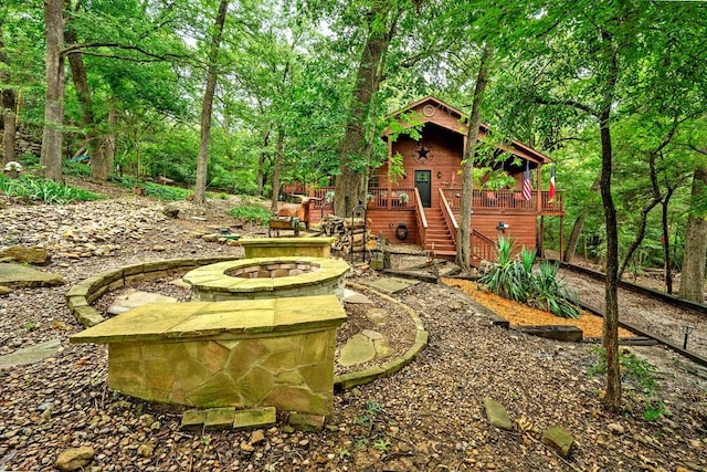 188 Hacienda, Pottsboro, TX 75076 - view of yard featuring a fire pit, a wooden deck, and stairway