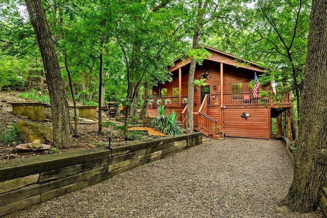 188 Hacienda, Pottsboro, TX 75076 - view of outdoor structure featuring covered porch and stairway