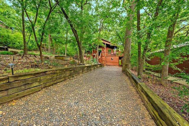 188 Hacienda, Pottsboro, TX 75076 - view of yard with a wooden deck and gravel driveway
