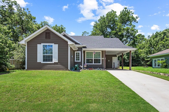 409 N Houston Ave, Denison, TX 75021 - view of front of home with concrete driveway and a carport