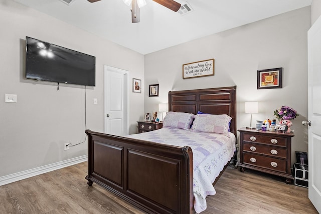 409 N Houston Ave, Denison, TX 75021 - bedroom featuring wood finished floors and ceiling fan