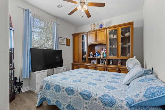 409 N Houston Ave, Denison, TX 75021 - bedroom with wood finished floors and ceiling fan