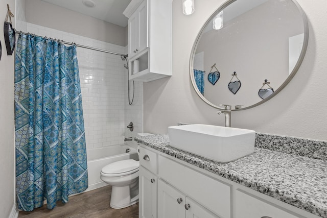 409 N Houston Ave, Denison, TX 75021 - bathroom with vanity, wood finished floors, and shower / bath combination with curtain