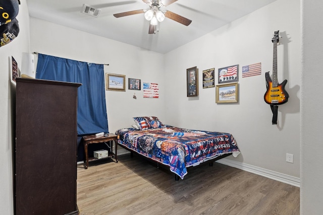 409 N Houston Ave, Denison, TX 75021 - bedroom featuring wood finished floors and a ceiling fan
