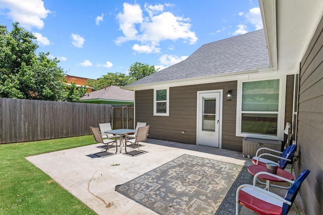 409 N Houston Ave, Denison, TX 75021 - fenced backyard featuring a patio and outdoor dining space