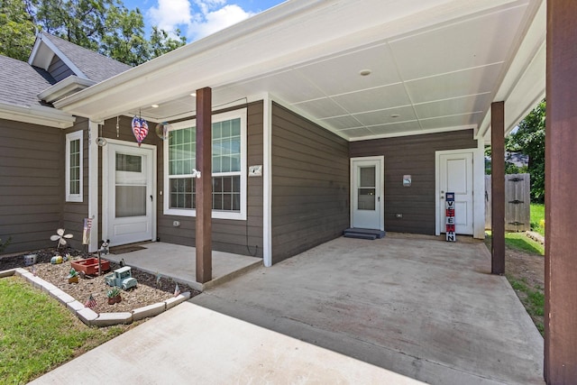 409 N Houston Ave, Denison, TX 75021 - entrance to property featuring a shingled roof and a carport