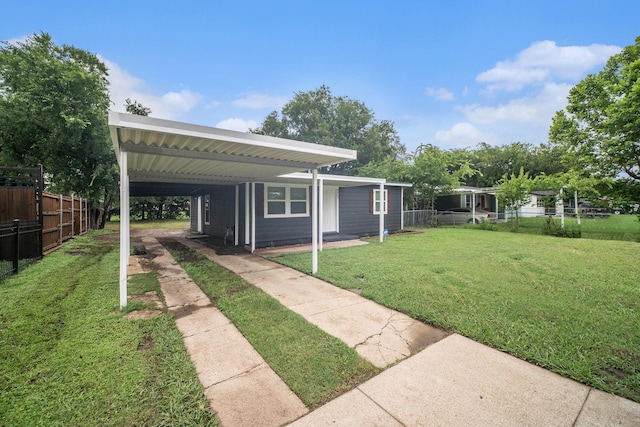 5525 Lester Granger Dr, Fort Worth, TX 76112 - view of yard featuring an attached carport and driveway