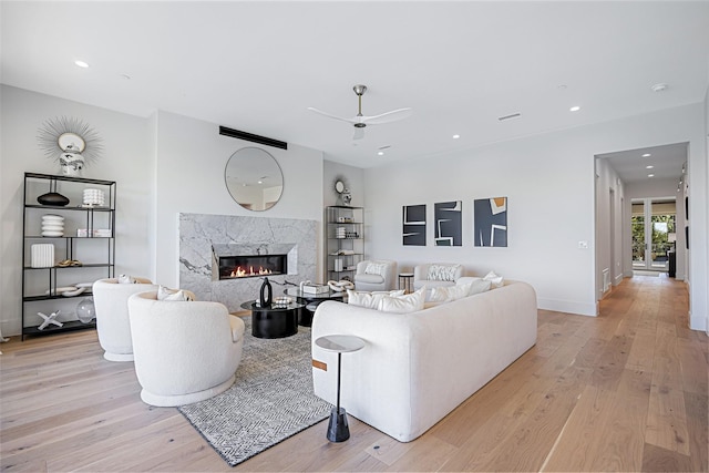 350 O Connor Ridge Blvd Unit 12, Irving, TX 75038 - living room featuring a ceiling fan, light wood finished floors, a premium fireplace, and recessed lighting