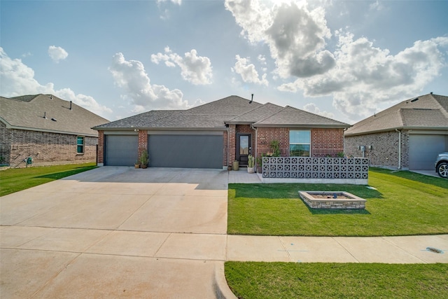436 Buckeye Ave, Princeton, TX 75407 - view of front of property with brick siding, a garage, driveway, and a front yard