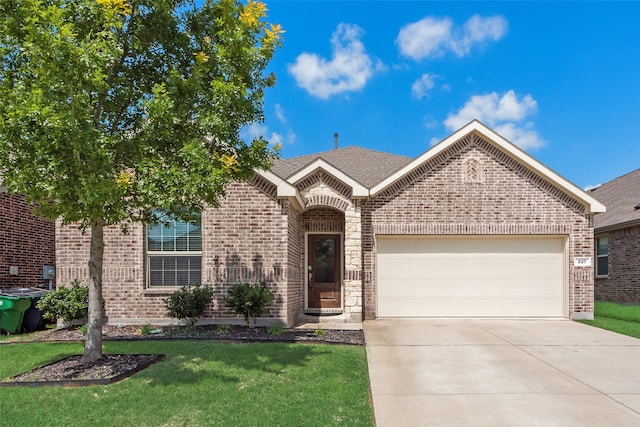 627 Beltrand Ln, Fate, TX 75087 - view of front of property with brick siding, a garage, concrete driveway, a front yard, and roof with shingles