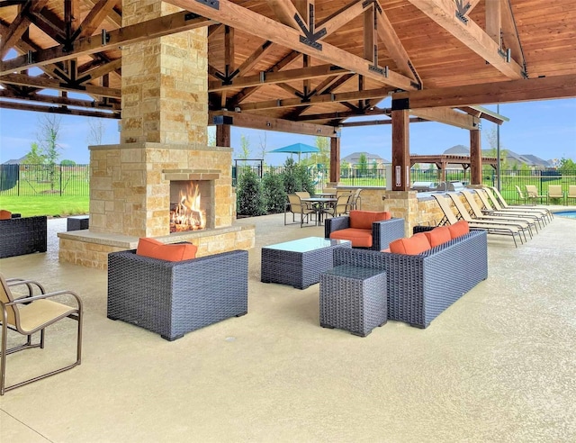627 Beltrand Ln, Fate, TX 75087 - view of patio with a gazebo and an outdoor living space with a fireplace