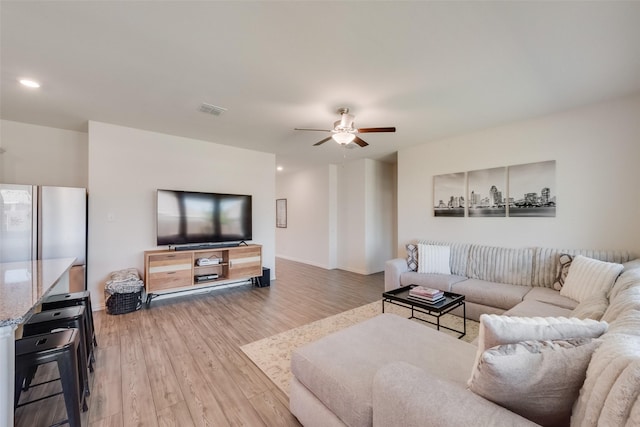 627 Beltrand Ln, Fate, TX 75087 - living room featuring light wood-style flooring and a ceiling fan