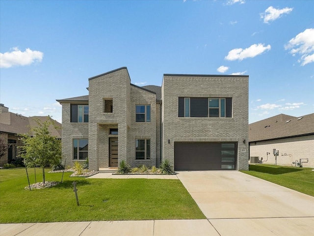 413 Coyote Creek Dr, Lavon, TX 75166 - contemporary house with driveway, brick siding, a front yard, and a garage