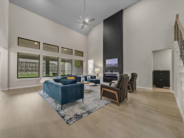 413 Coyote Creek Dr, Lavon, TX 75166 - living area with high vaulted ceiling, ceiling fan, and light wood-style floors