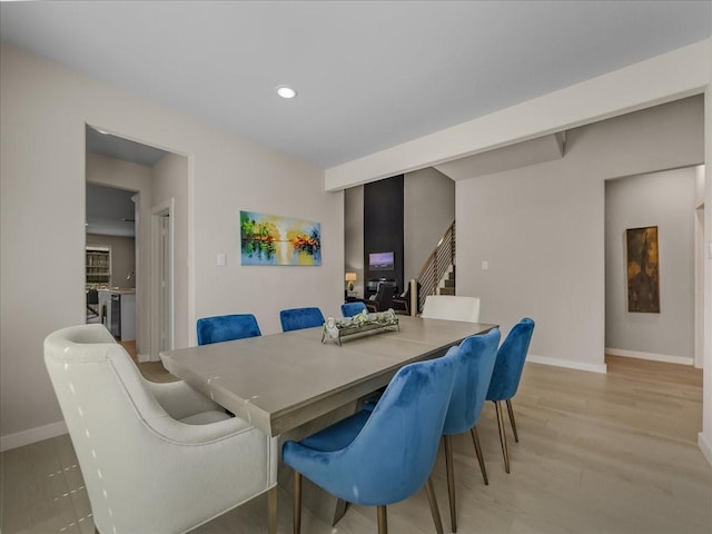 413 Coyote Creek Dr, Lavon, TX 75166 - dining area featuring light wood-type flooring, recessed lighting, and stairway